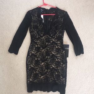 Brand new, never worn Bebe black lace dress